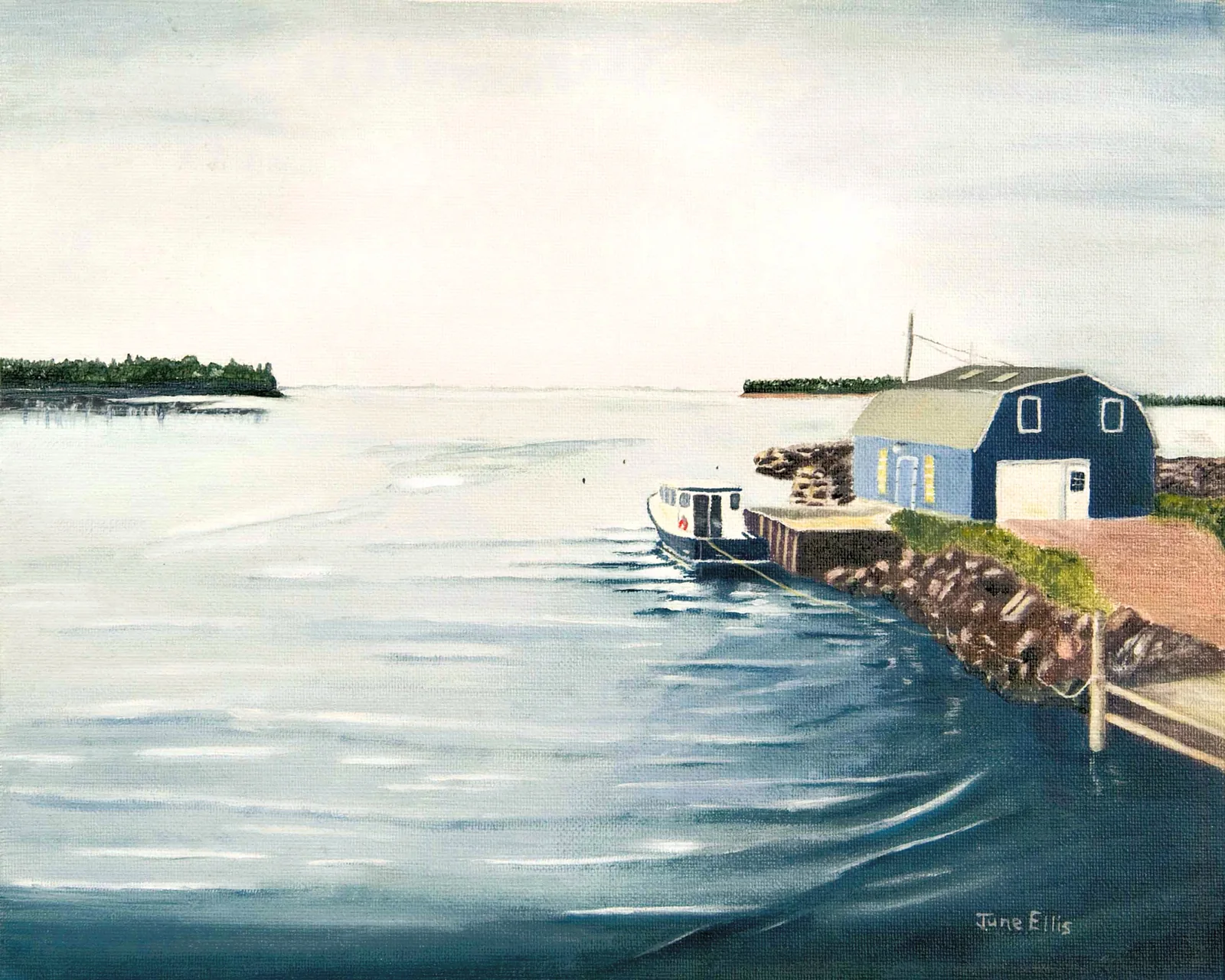 Blue water with dock and barn in the background