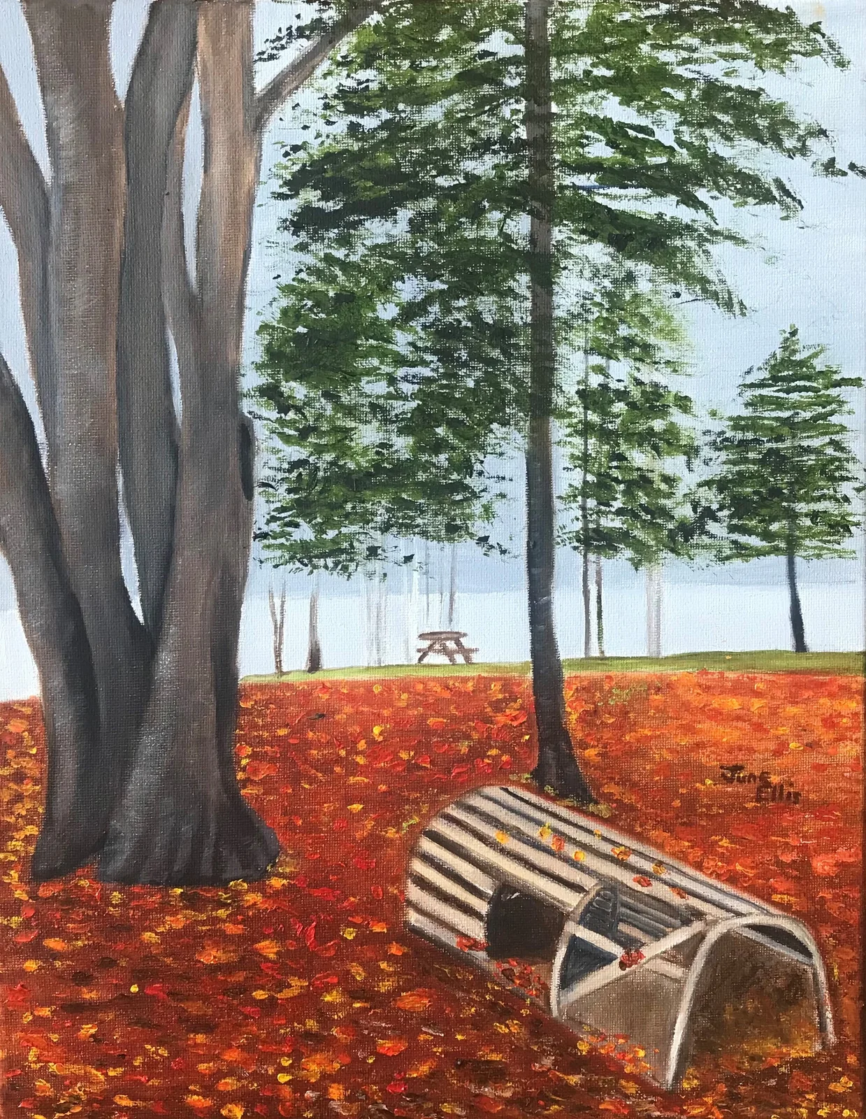 Fall scene with leaves on the ground and lobster trap in the foreground