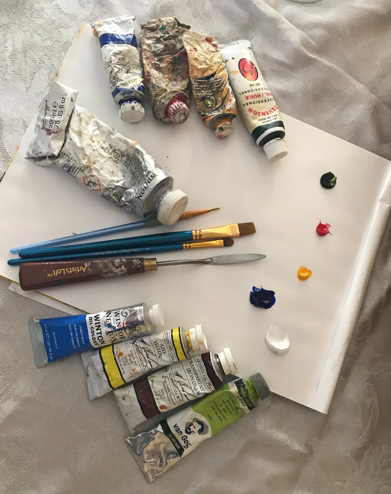 Paints and brushes laid out for a class